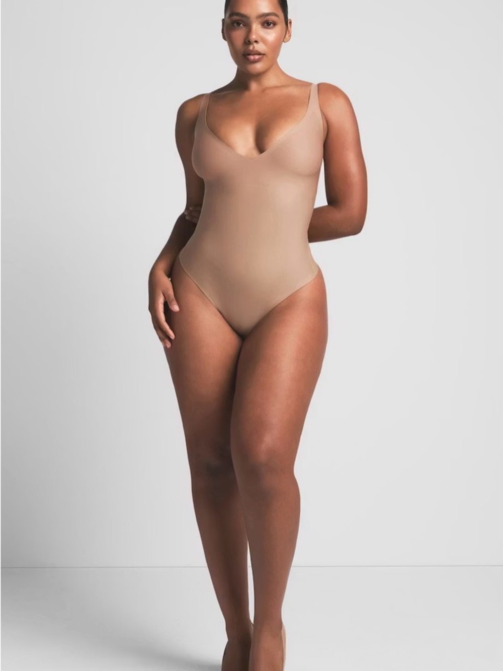 SKIMS CORE SCULPT PLUNGE THING BODYSUIT IN SIENNA